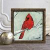 Red cardinal prints in reclaimed wood frames.
